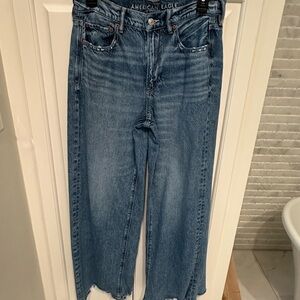 American Eagle Outfitters Women's Dreamy Drape high rise, wide leg, jeans.